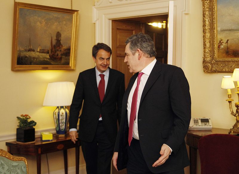 Britain's Prime Minster Gordon Brown arrives with his Spanish counterpart Jose Luis Rodriguez Zapatero ahead of a news conference at Downing Street in London