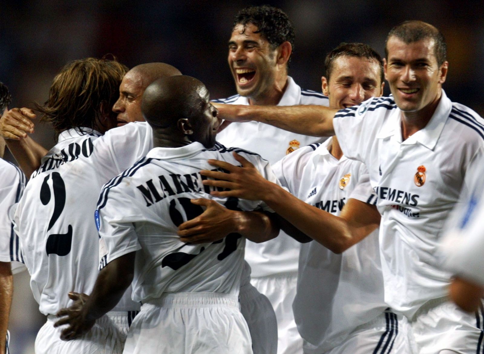 Roberto Carlos is 2nd-L Brazilian Real Madrid's Roberto Carlos (2nd-L) is congratulated by team mate..