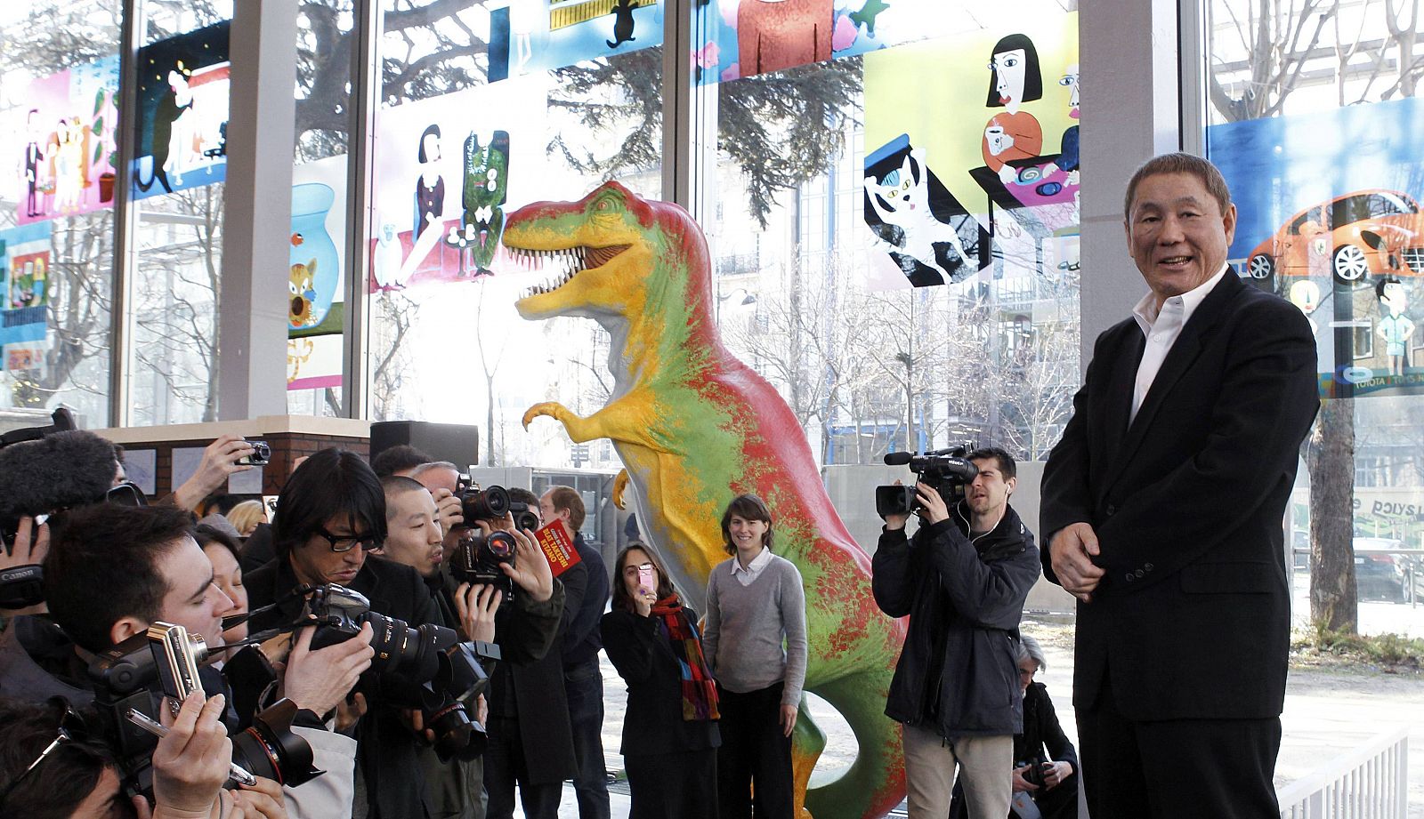 Japanese artist Kitano reacts during a photocall at the Cartier Foundation for Contemporary Art for his show in Paris