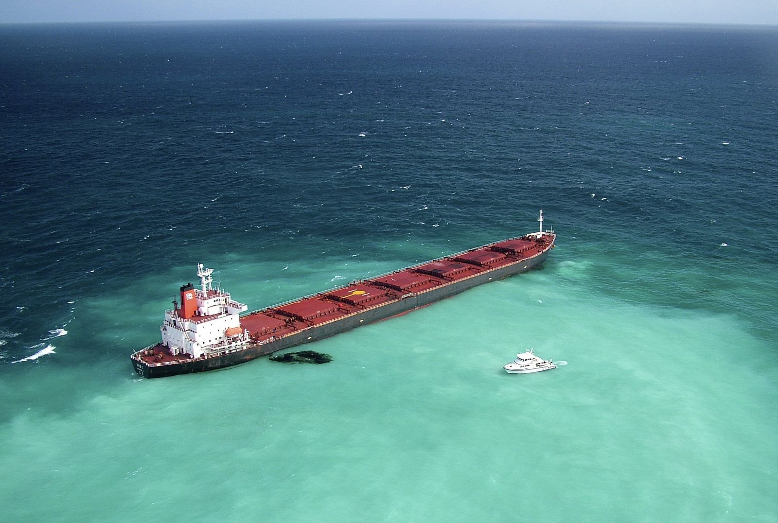 Oil is seen next to the 230m-long bulk coal carrier Shen Neng I about 70 km east of Great Keppel Island