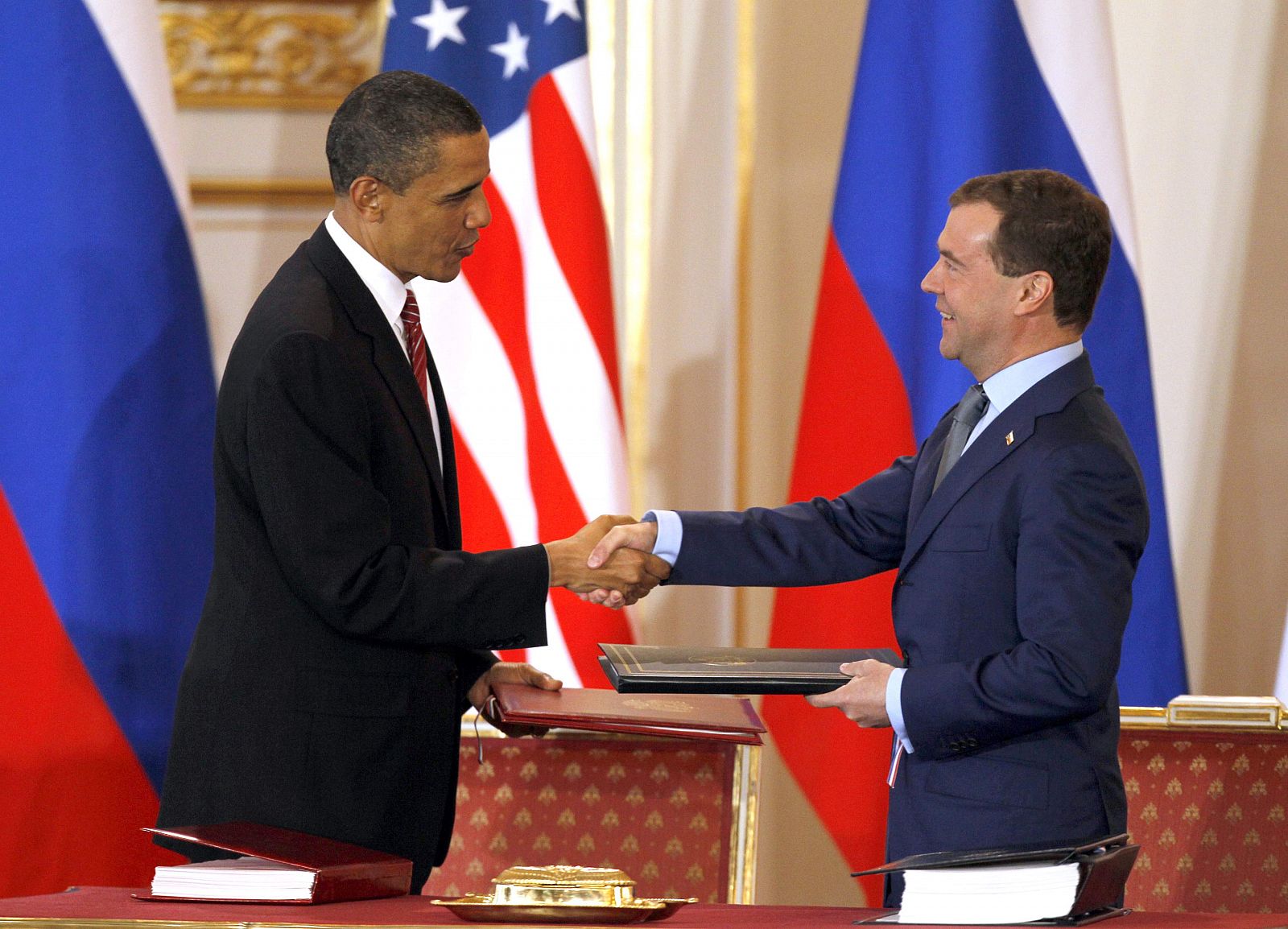 US.President Obama and Russian President Medvedev exchange signed  new Strategic Arms Reduction Treatyat Prague Castle