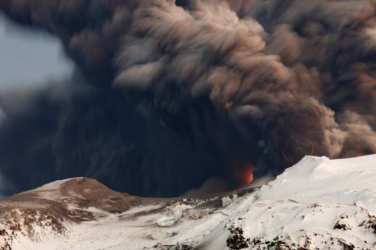 Smoke and lava are seen as a volcano erupts in Eyjafjallajokul