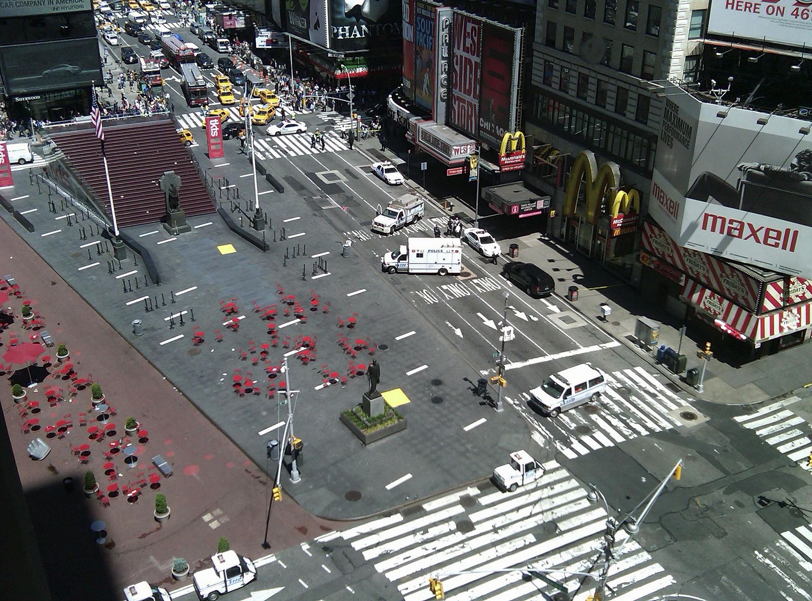 An area of Times Square is evacuated as police investigate a suspicious package on the street in New York
