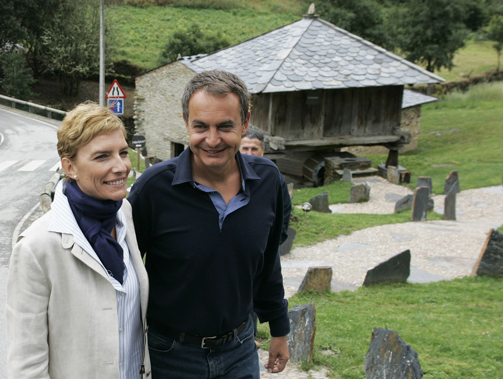 Spain's PM Zapatero and his wife stroll through a rural village in Spain