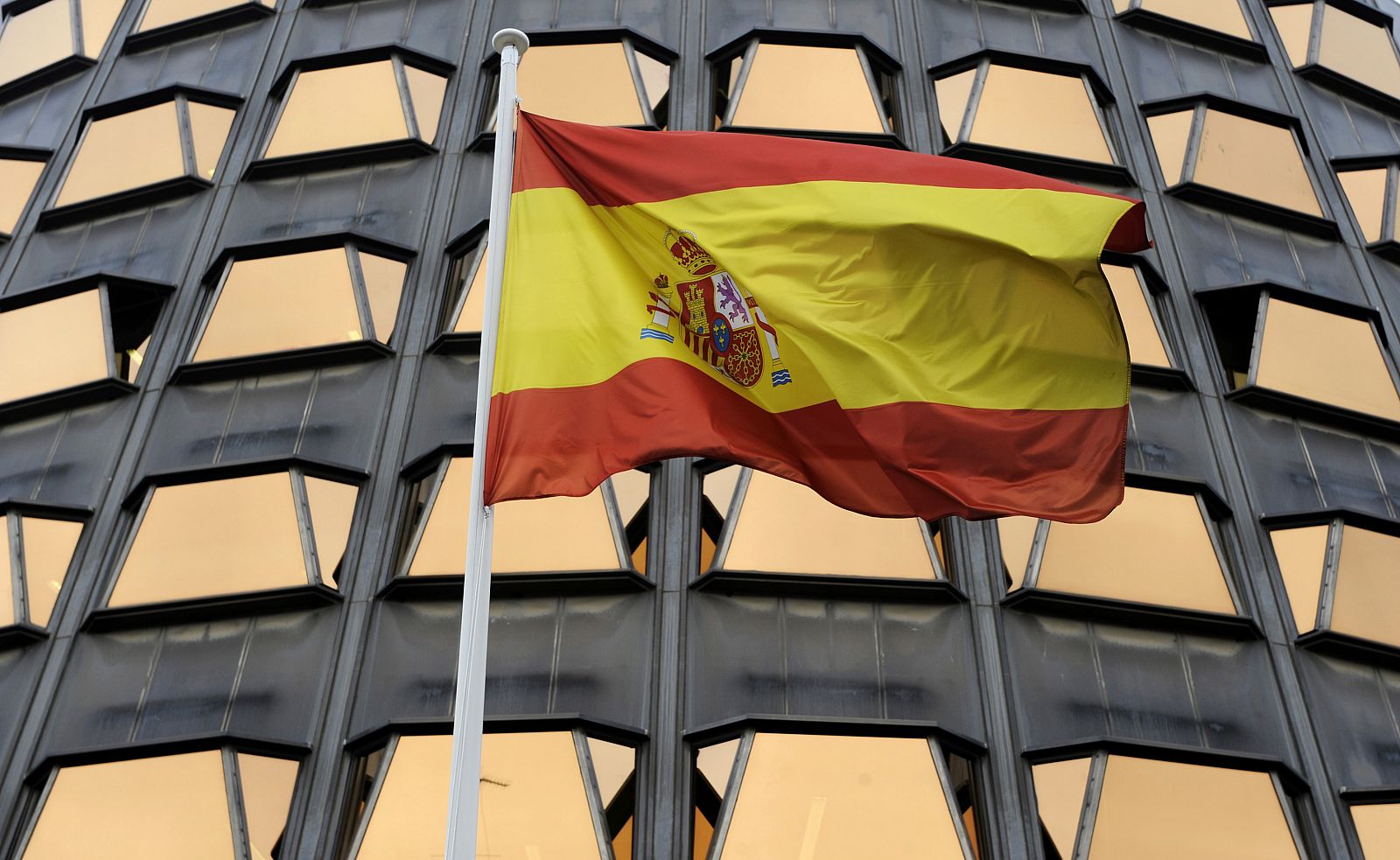 The Spanish flag flies in front of the Constitutional Tribunal in Madrid