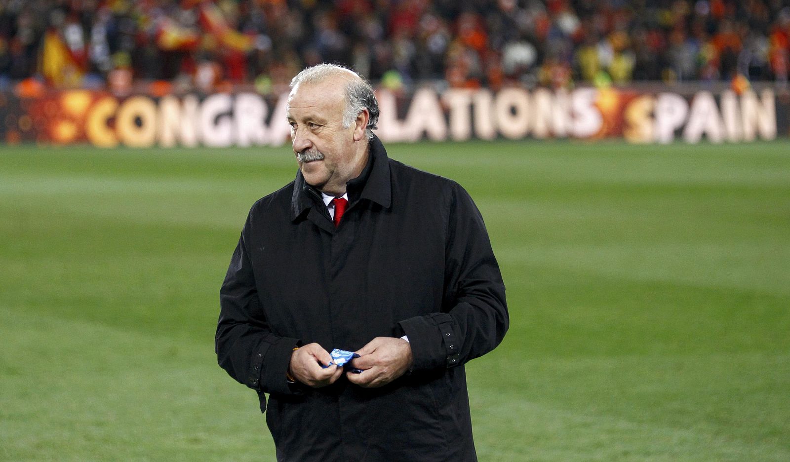 Spain's coach Vicente del Bosque stands on the pitch after their 2010 World Cup final soccer match against Netherlands at Soccer City stadium