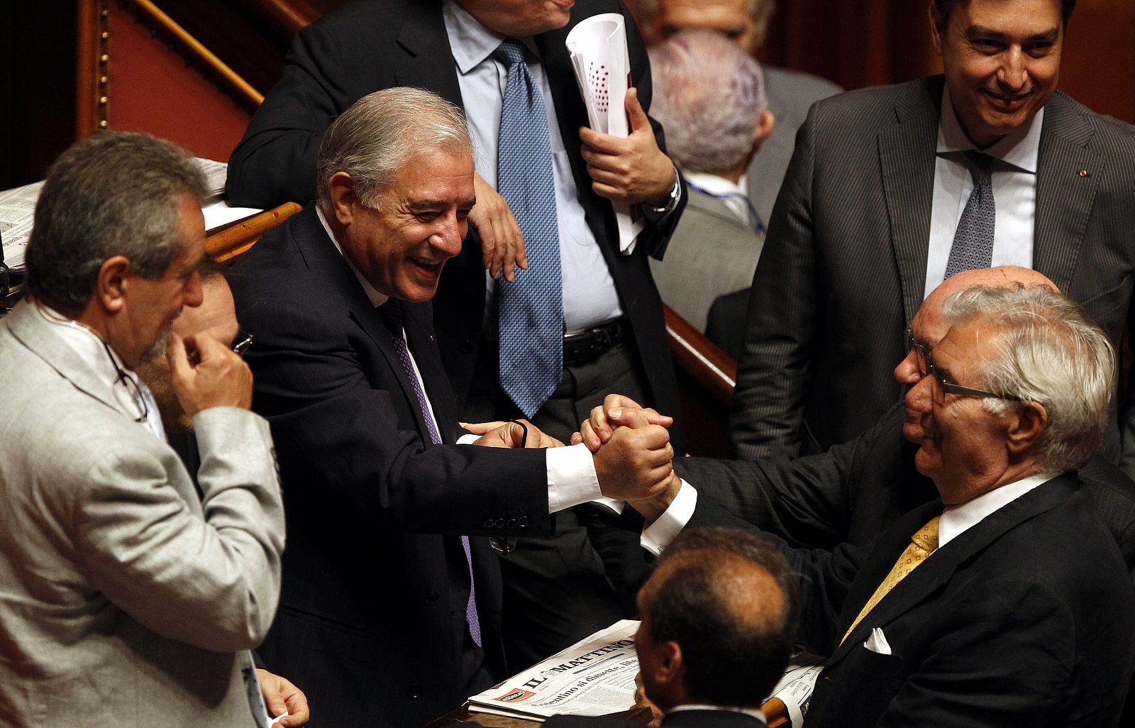 Senator Dell'Utri celebrates after voting at the Senate in Rome