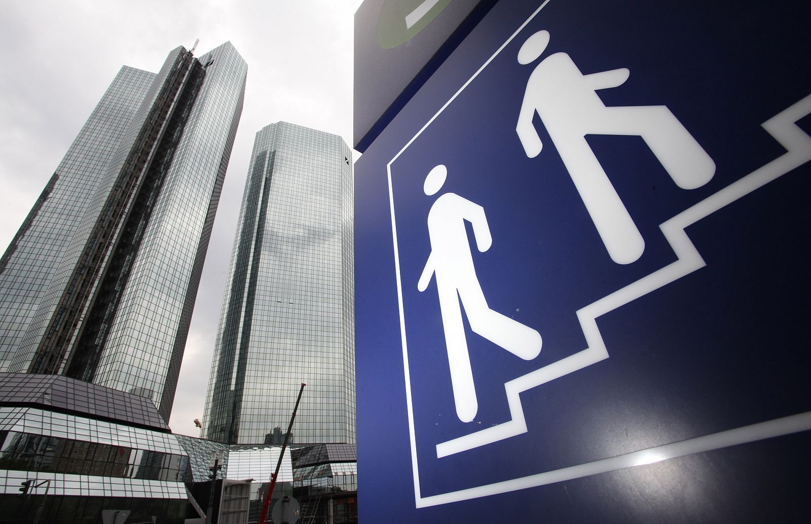 The headquarters of Deutsche Bank are pictured next to a pictograph in Frankfurt