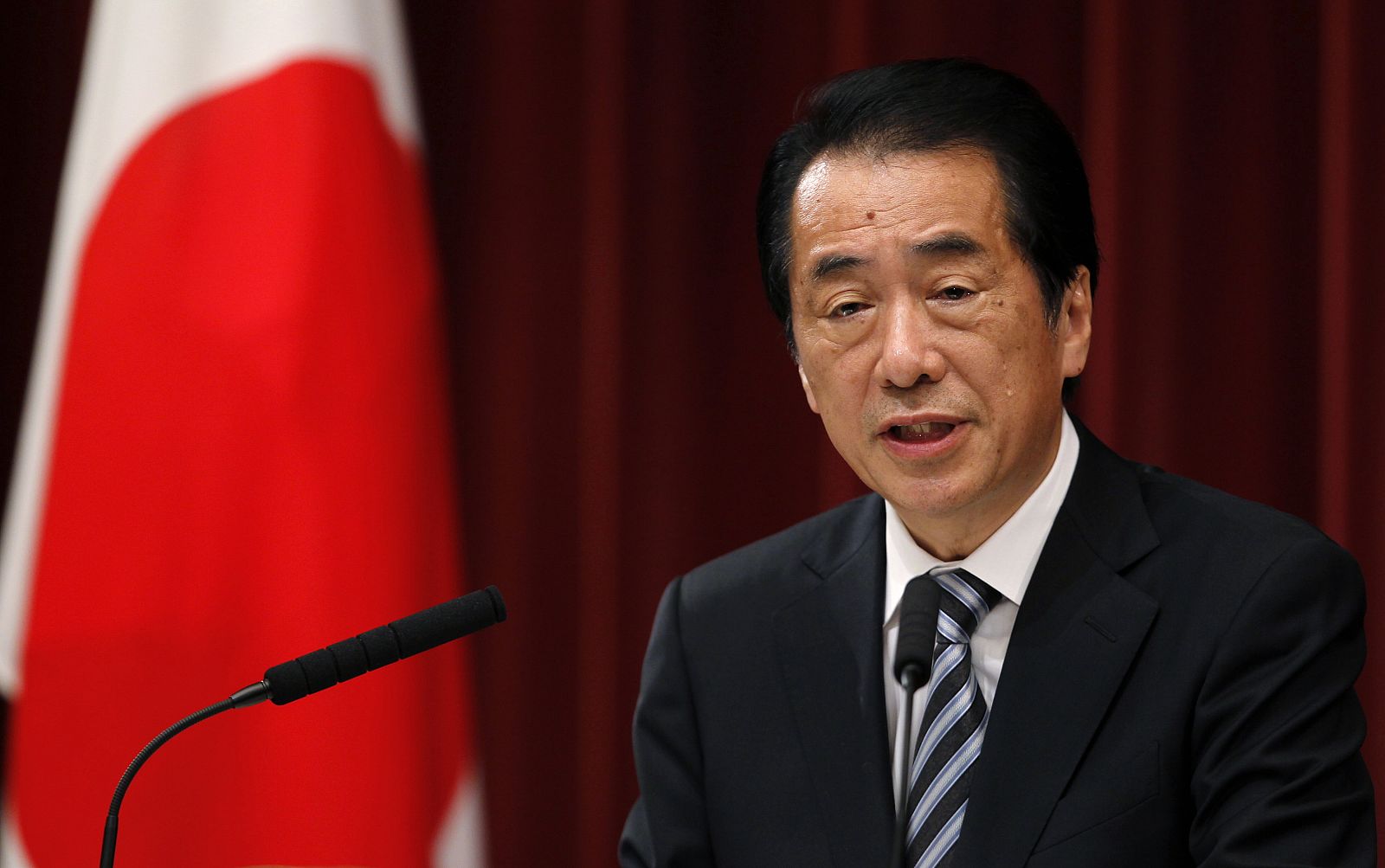 Japan's Prime Minister Kan speaks at a news conference in Tokyo