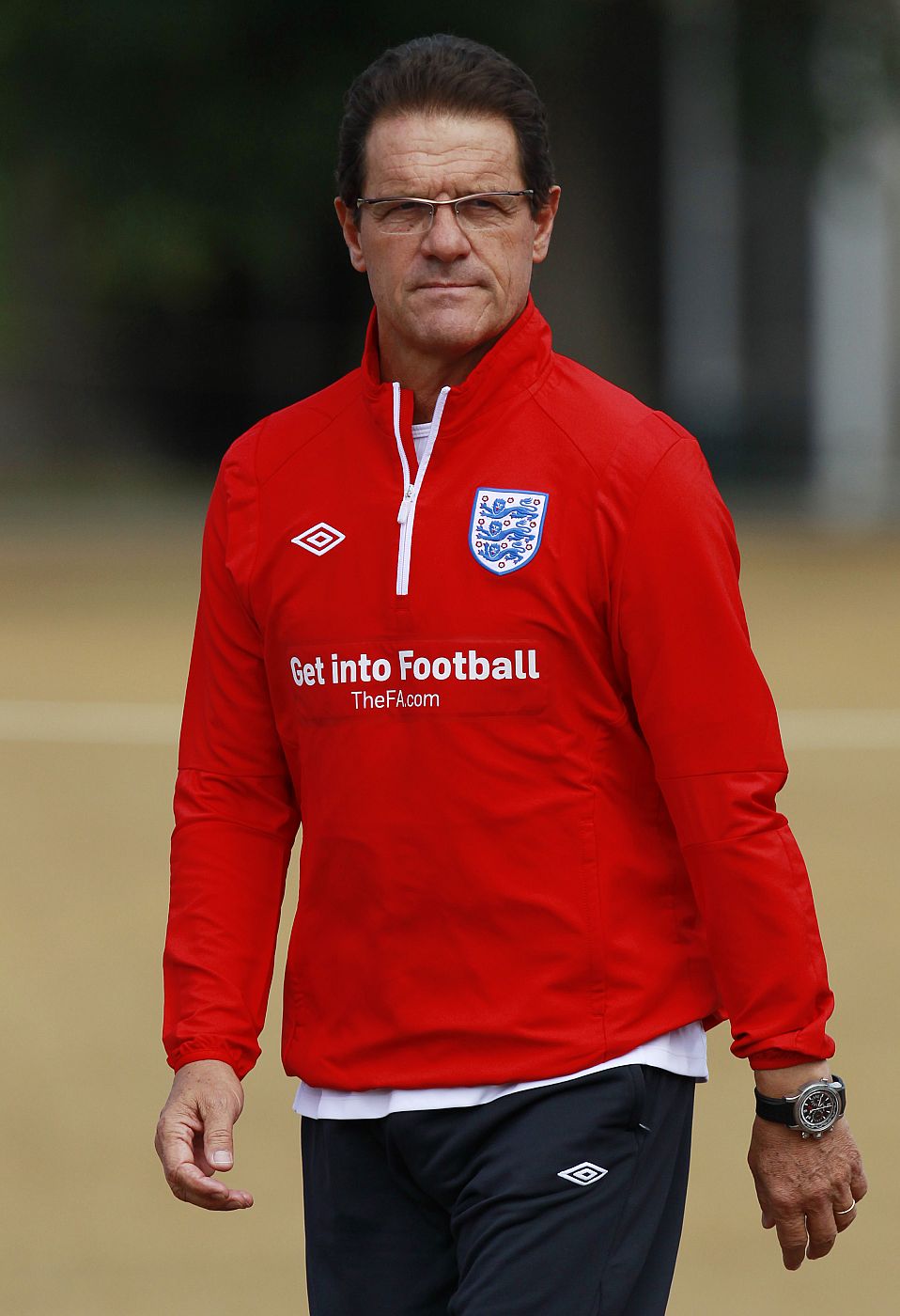 England soccer manager Fabio Capello watches players during a training session at London Colney