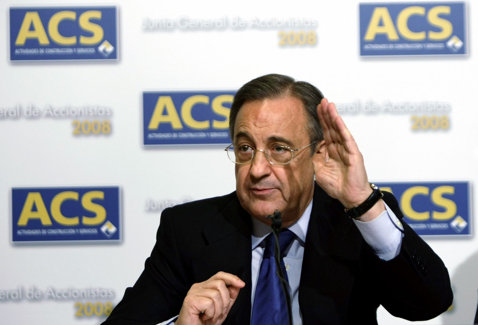 Perez, chairman of ACS, gestures during a news conference after company's annual shareholders meeting in Madrid