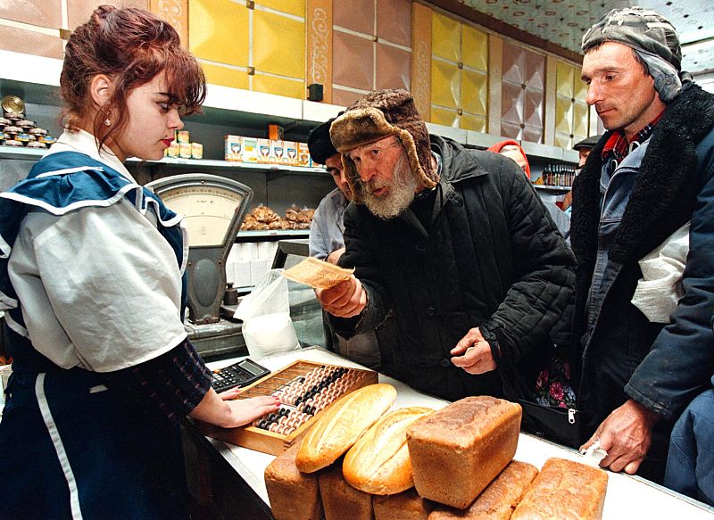 AN OLD BELARUS MAN BUYS BREAD.