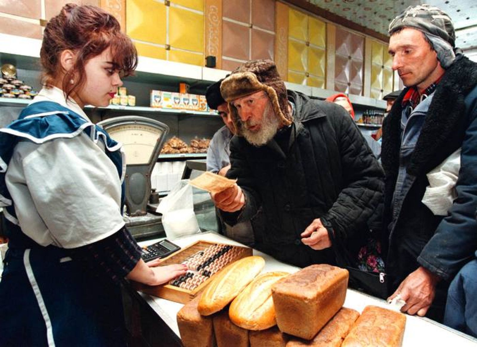 AN OLD BELARUS MAN BUYS BREAD.