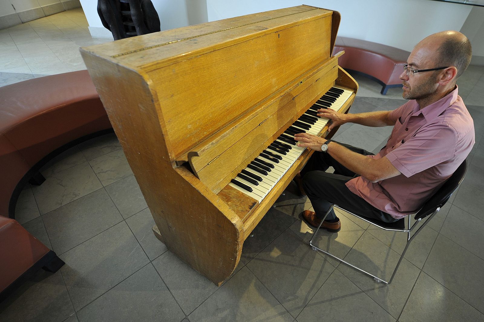 British fashion designer Hemingway plays a piano at the Bonhams auction rooms in Bond Street in central London