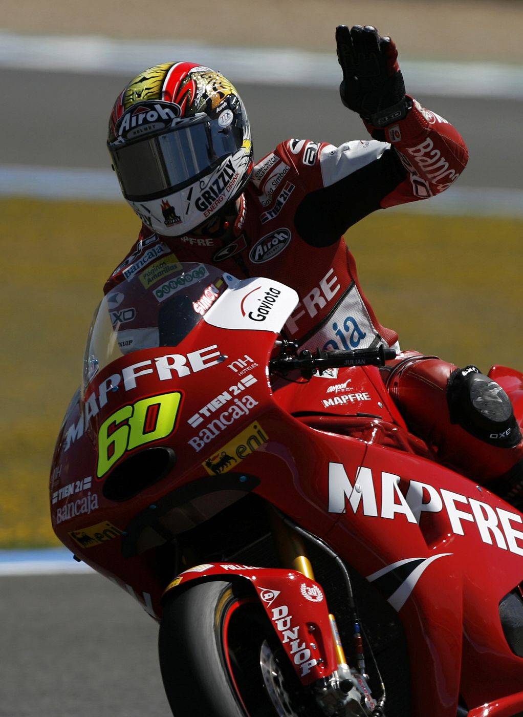 RSV Moto2 rider Simon of Spain gestures to the crowd during the qualifying practice session of the Spanish Grand Prix in Jerez