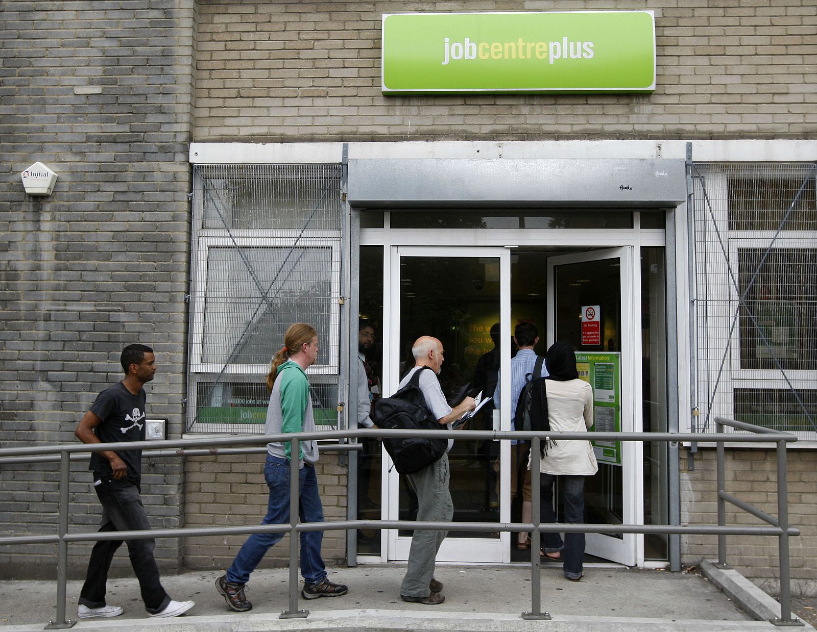 People enter a job centre in London