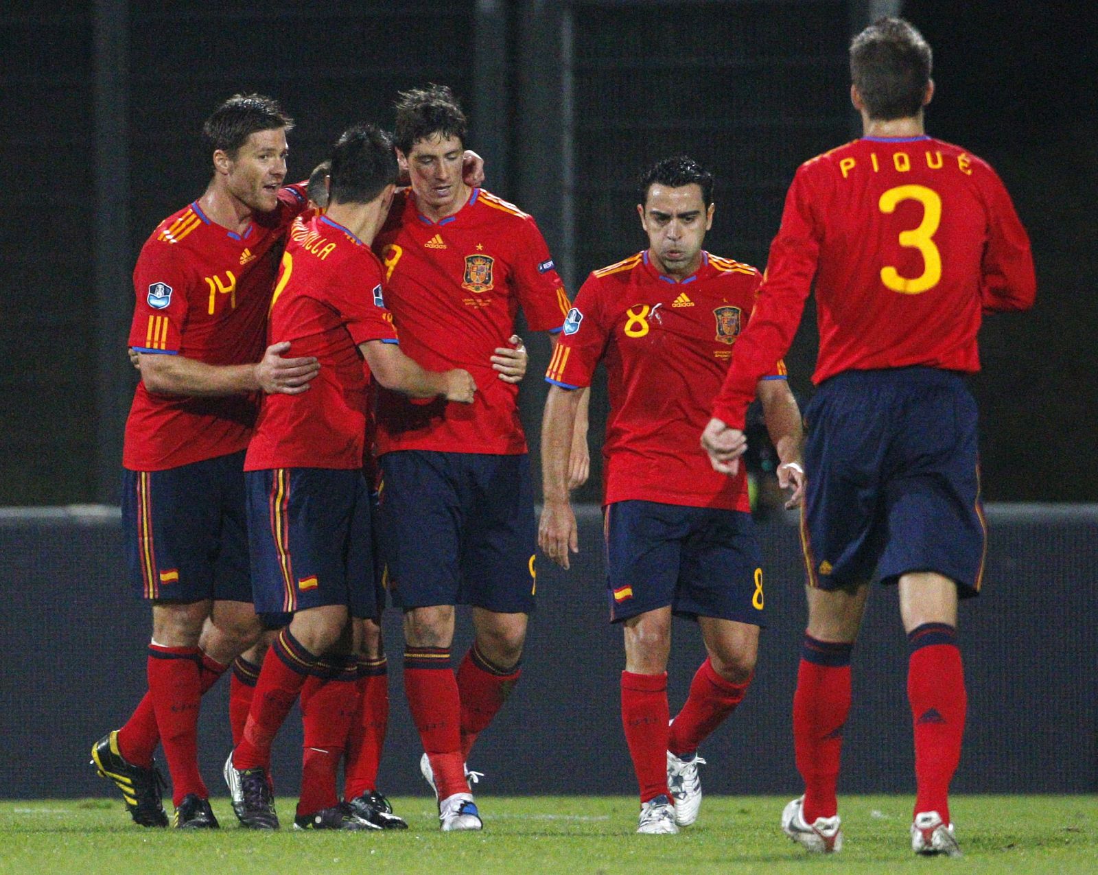 Spain players celebrate after Torres scores the first goal during their Euro 2012 qualifying soccer match against Liechtenstein in Vaduz