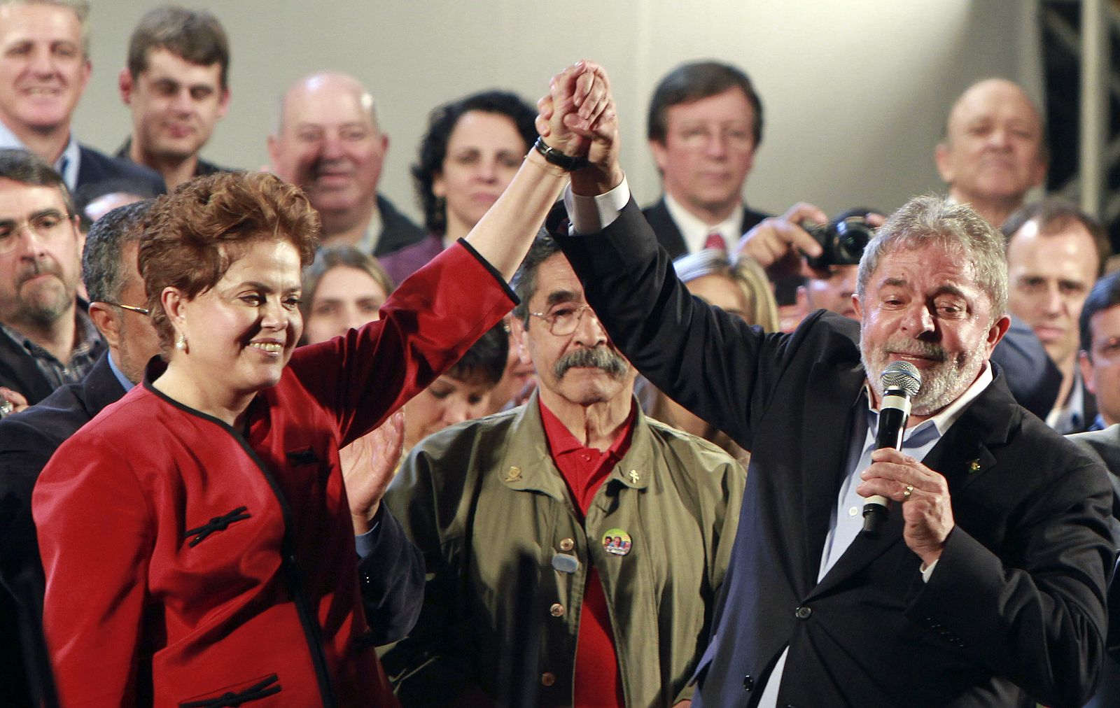 Brazil's President Luiz Inacio Lula da Silva raises the hand of Brazil's ruling Workers' Party presidential candidate Dilma Rousseff during a campaign rally in Porto Alegre
