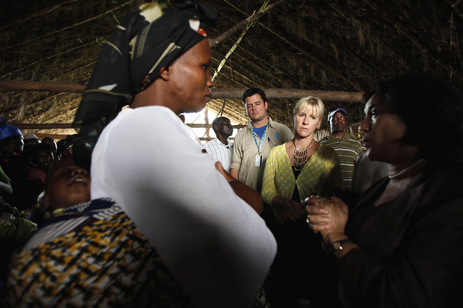 Margot Wallstrom, the UN's special representative on sexual violence, listens to villagers in Kitchanga, in eastern Democratic Republic of Congo