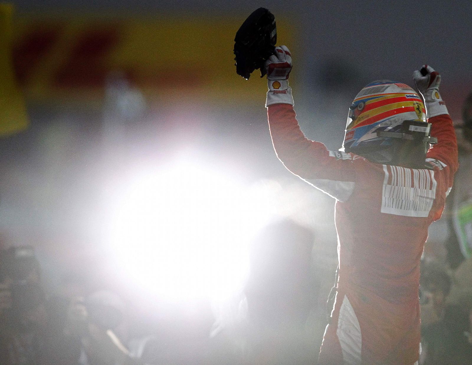 Ferrari Formula One driver Fernando Alonso of Spain celebrates after winning the South Korean F1 Grand Prix at the Korea International Circuit in Yeongam