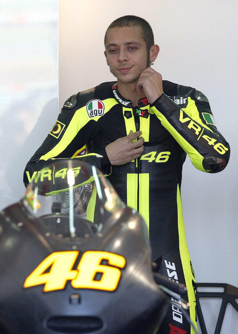 MotoGP rider Valentino Rossi of Italy smiles as he prepares for a training session with his new Ducati at the Ricardo Tormo racetrack near Valencia