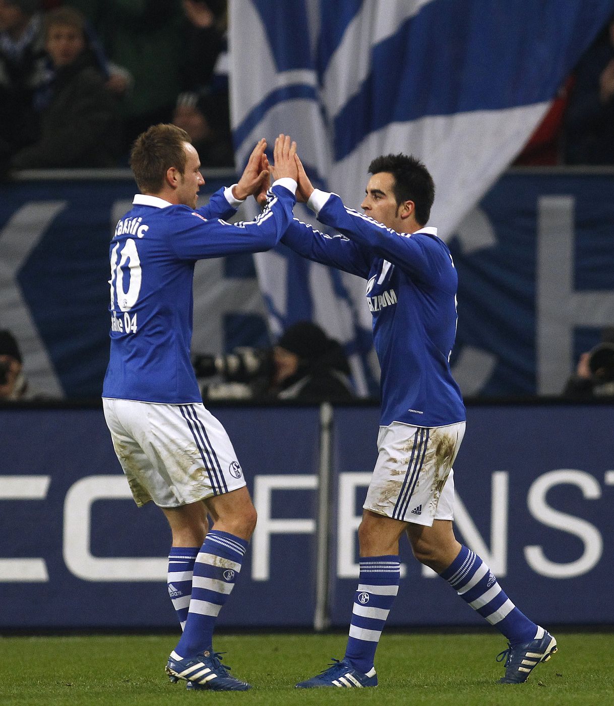 Schalke 04's Jurado and Rakitic celebrate a goal against Bayern Munich during the German Bundesliga soccer match in Gelsenkirchen