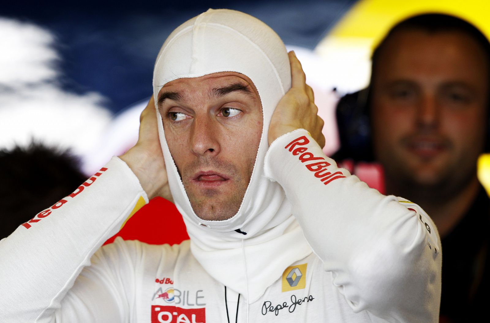 Red Bull Formula One driver Webber of Australia sits in the pits during the first session of the Abu Dhabi F1 Grand Prix at Yas Marina circuit