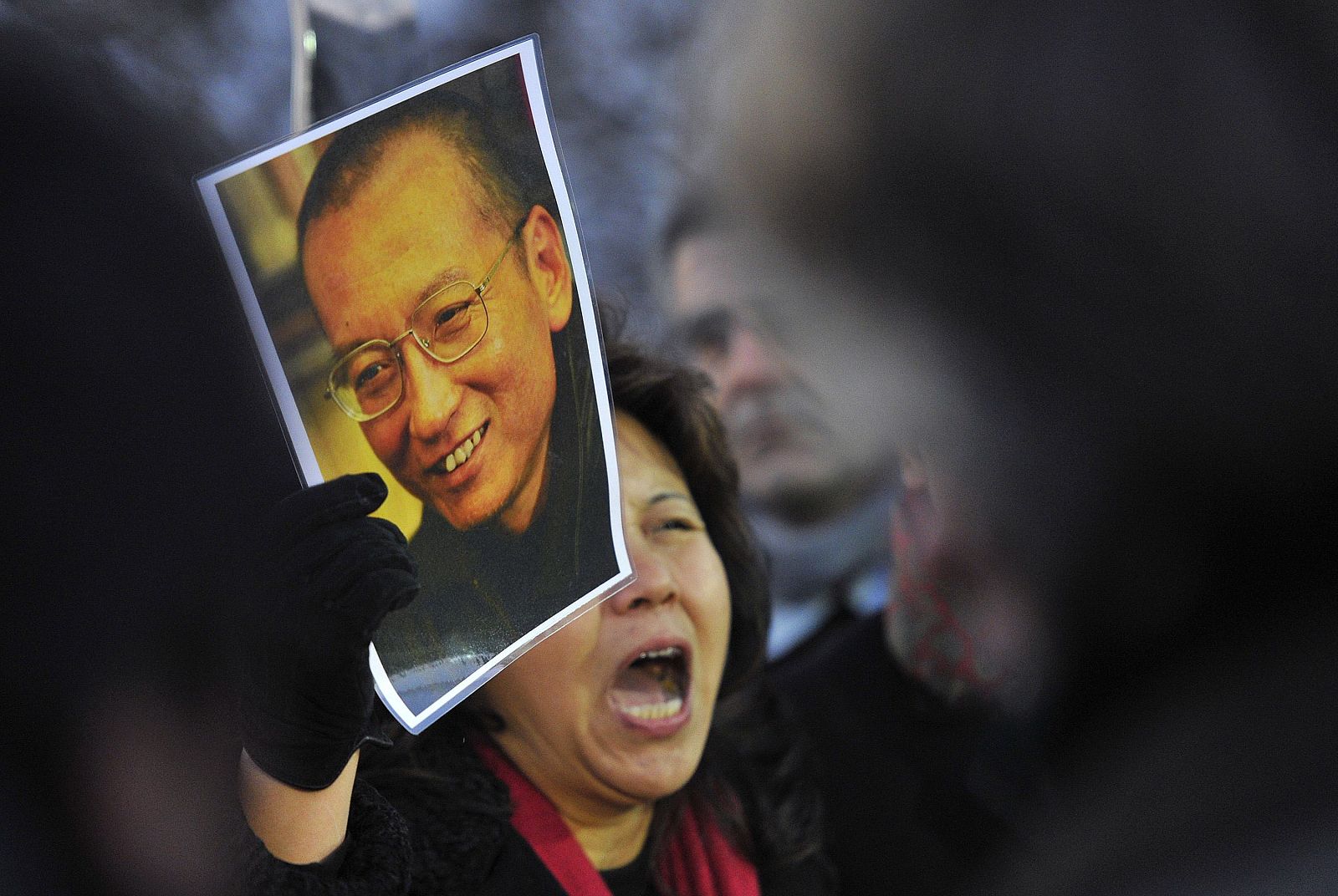 Protester holds image of jailed dissident Liu outside of the Chinese Embassy in Oslo