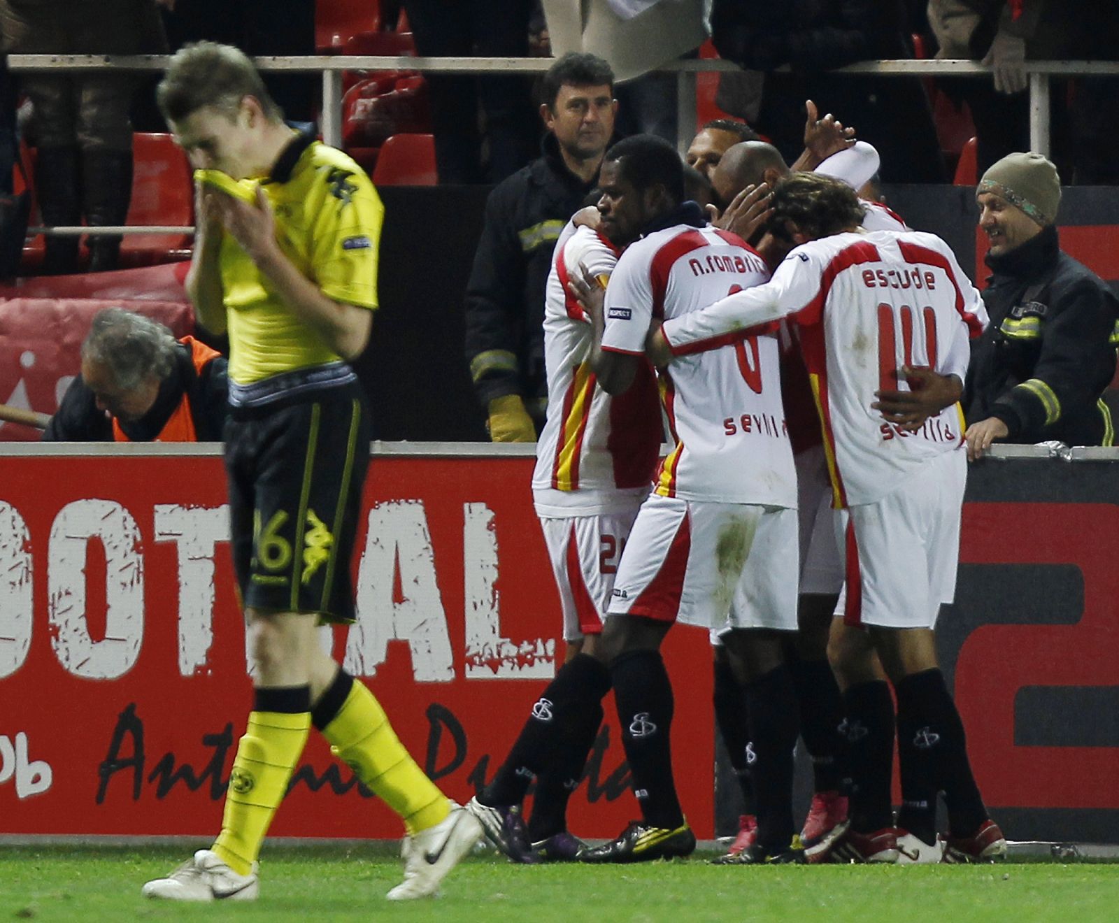 Sevilla's Kanoute is congratulated by teammates after scoring against Borussia Dortmund in Seville