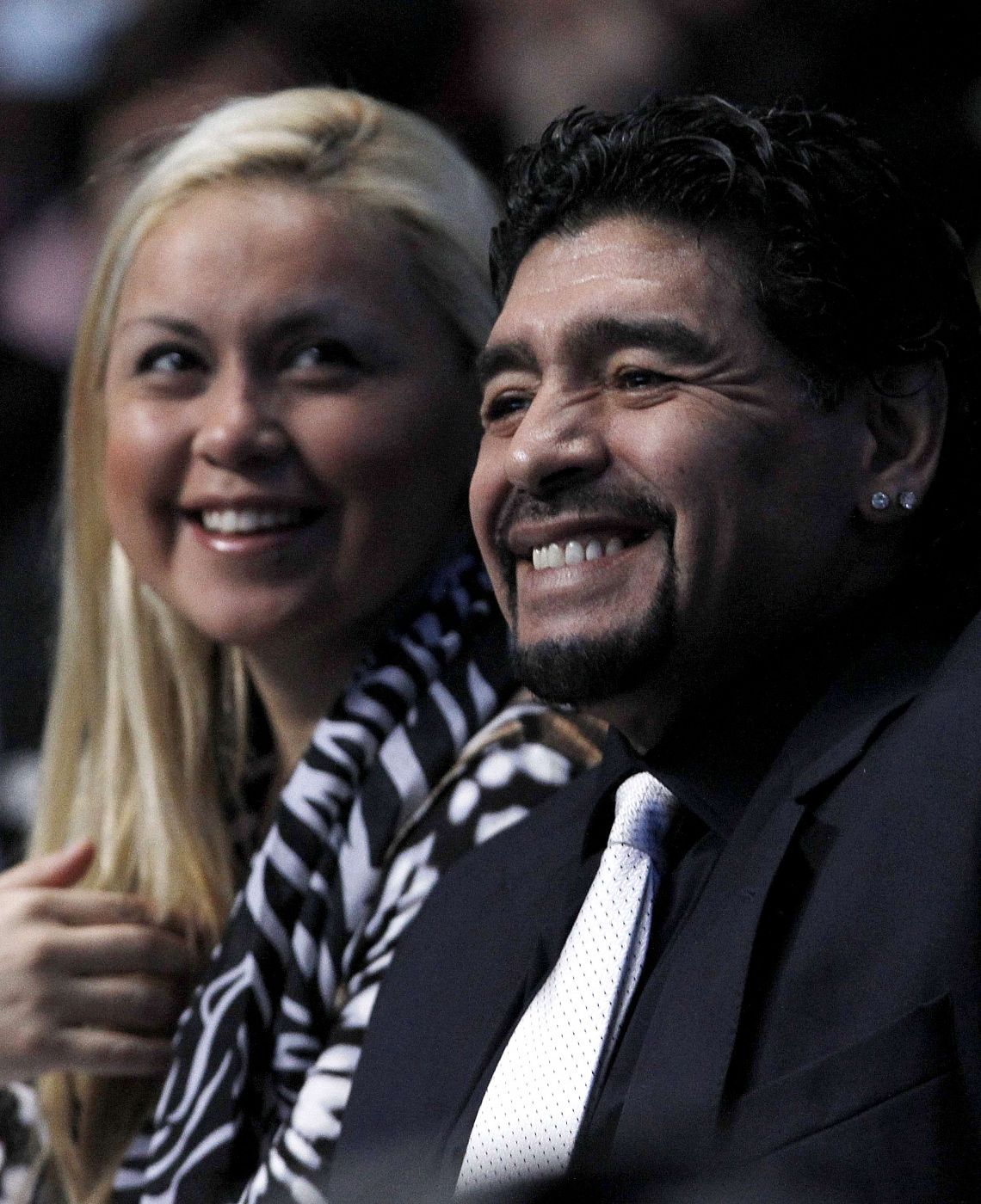 Former Argentine soccer star Maradona and Ojeda watch the finals match between Spain's Nadal and Switzerland's Federer at the ATP World Tour Finals in London