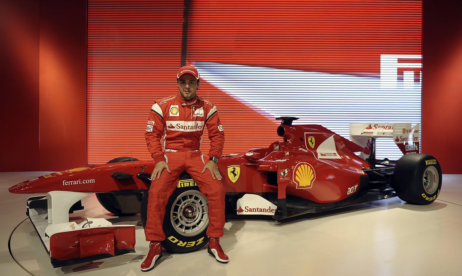 Ferrari's driver Felipe Massa of Brazil poses near the new Ferrari F150 Formula One car in Maranello