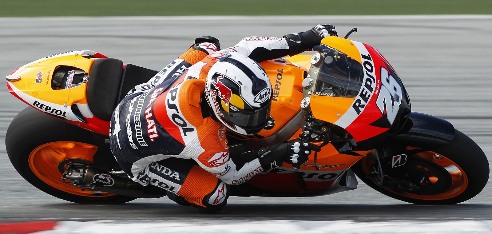 Honda MotoGP rider Dani Pedrosa of Spain takes a corner during test session in Sepang