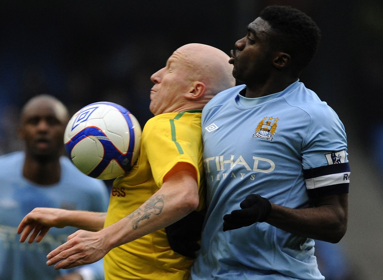 Manchester City's Toure challenges Notts County's Hughes during their FA Cup soccer match at Manchester