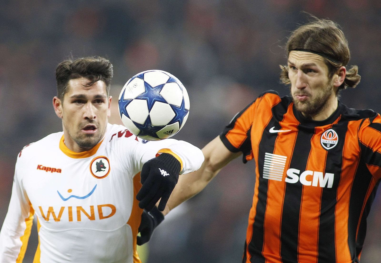 AS Roma's XBorriello challenges Shakhtar Donetsk's Chygrynskiy during their Champions League soccer match in Donetsk