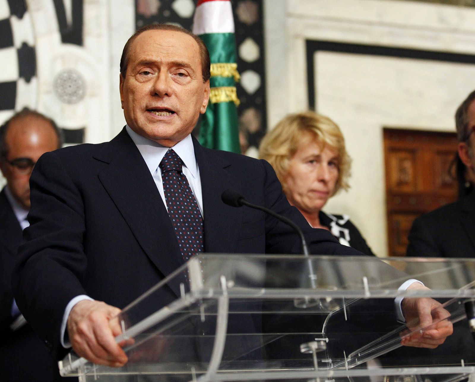 Italian Prime Minister Silvio Berlusconi speaks during a news conference in Tunis