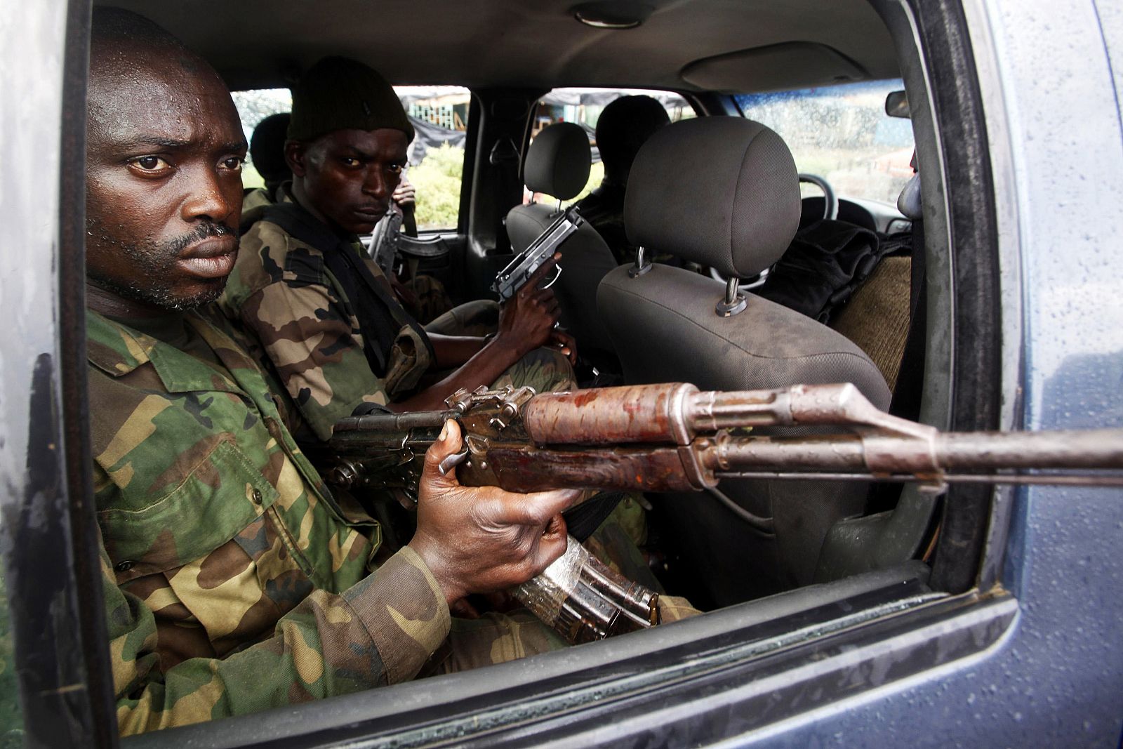 Soldiers loyal to Ivory Coast presidential claimant Alassane Ouattara drive to the front line during fighting on the northern outskirts of Abidjan