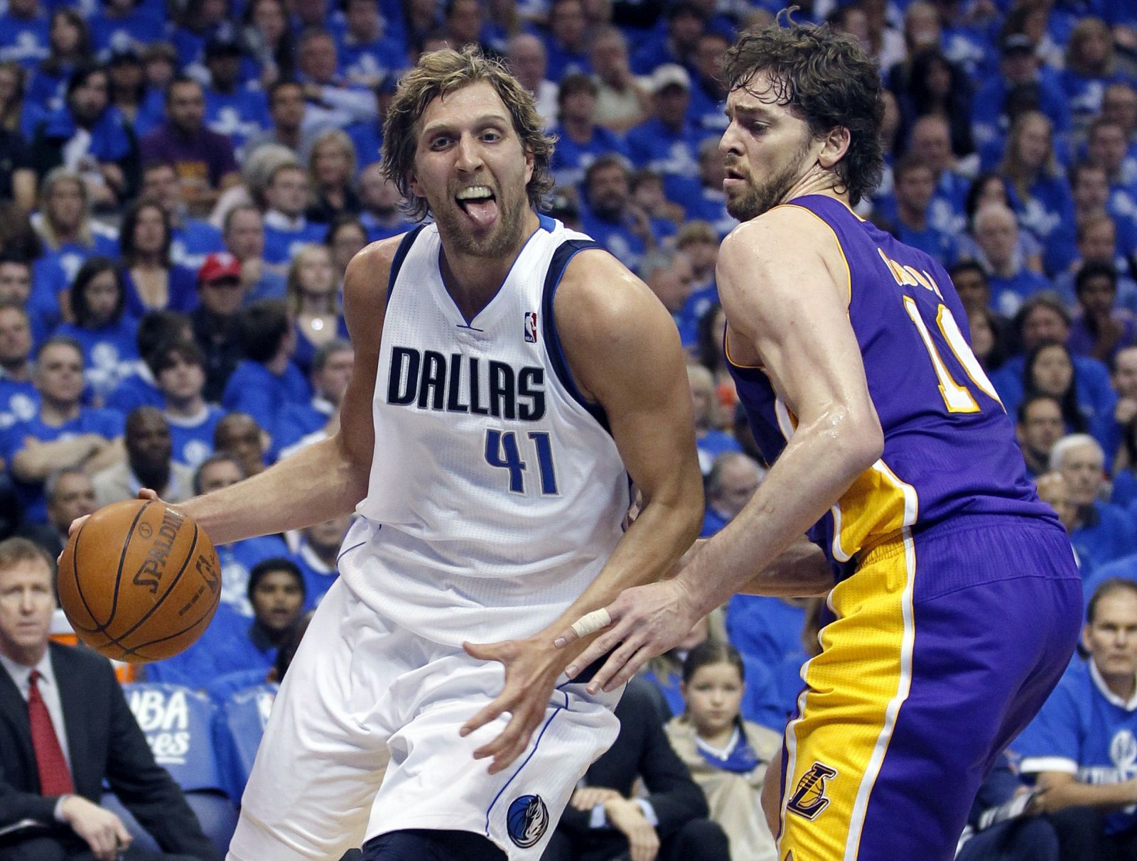 Dallas Mavericks power forward Dirk Nowitzki drives to the basket past Los Angeles Lakers power forward Pau Gasol in Dallas