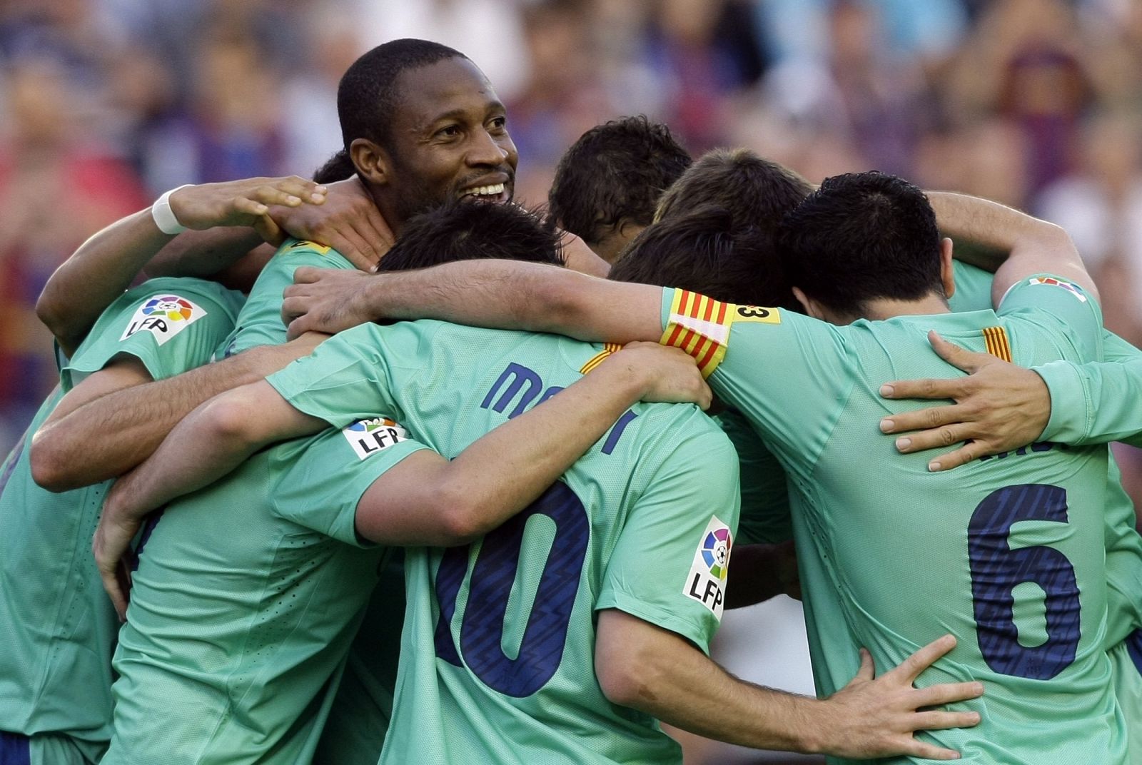 Barcelona's Keita is congratulated by team mates after scoring a goal against Levante during their Spanish first division soccer match in Valencia