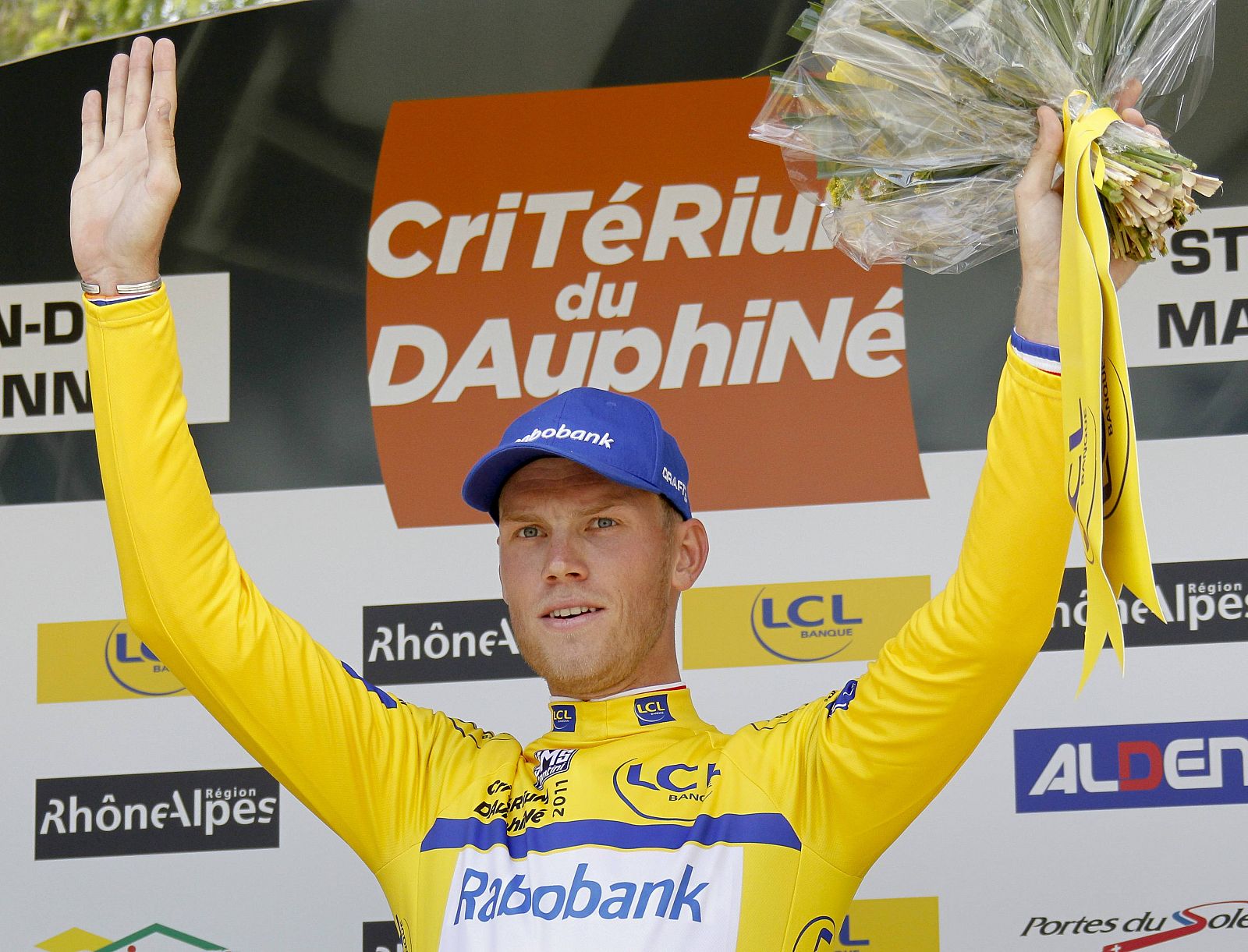 Rabobank's Lars Boom of the Netherlands wears the leader's yellow jersey after winning the individual time trial prologue of the Dauphine cycling race in Saint-Jean-de-Maurienne