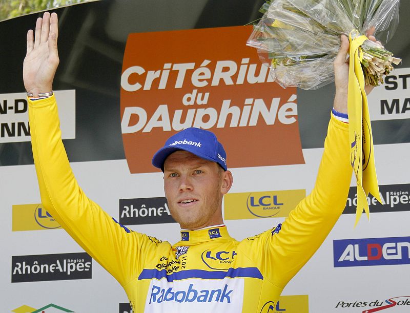Rabobank's Lars Boom of the Netherlands wears the leader's yellow jersey after winning the individual time trial prologue of the Dauphine cycling race in Saint-Jean-de-Maurienne