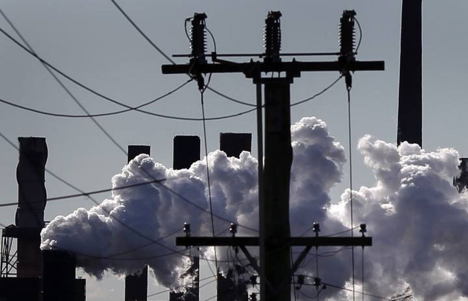 Vapour pours from a steel mill chimney in the industrial town of Port Kembla