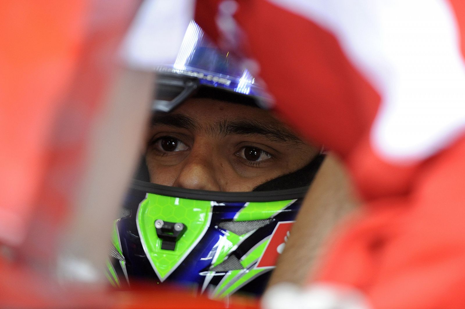 Ferrari Formula One driver Massa of Brazil watches his monitor during third practice for the British F1 Grand Prix at Silverstone