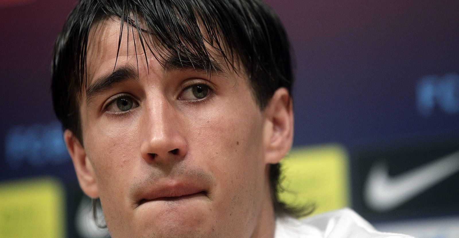 Spanish soccer player Bojan Krkic reacts during a news conference at Camp Nou stadium in Barcelona