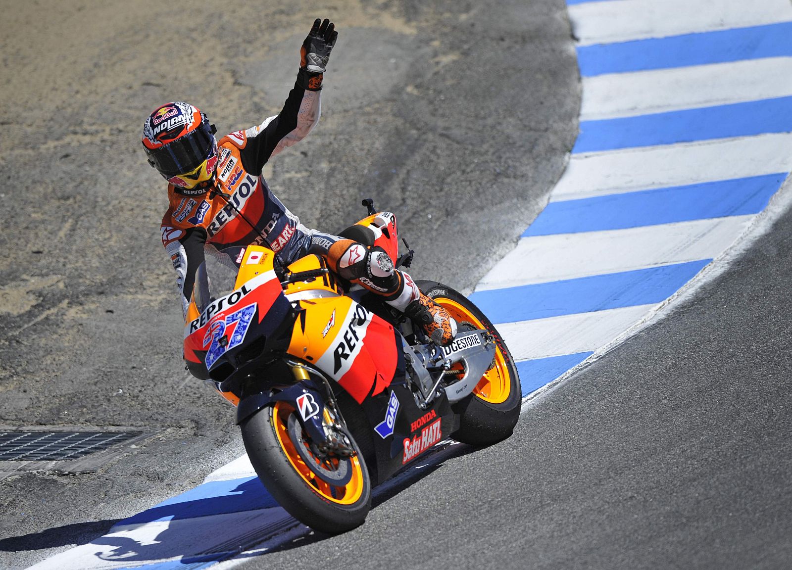 Honda MotoGP rider Casey Stoner of Australia waves to the crowd on the "Corkscrew" turn after winning  the U.S. Grand Prix at Mazda Raceway Laguna Seca in Monterey.