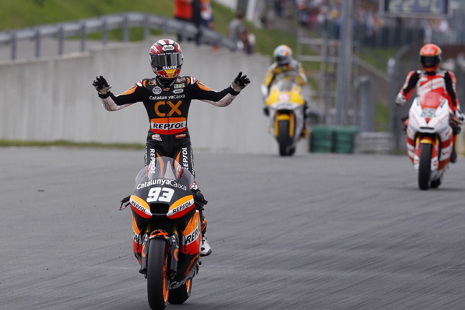 Suter Moto2 rider Marquez of Spain celebrates after winning the German Grand Prix at the Sachsenring circuit in the eastern German town of Hohenstein-Ernstthal