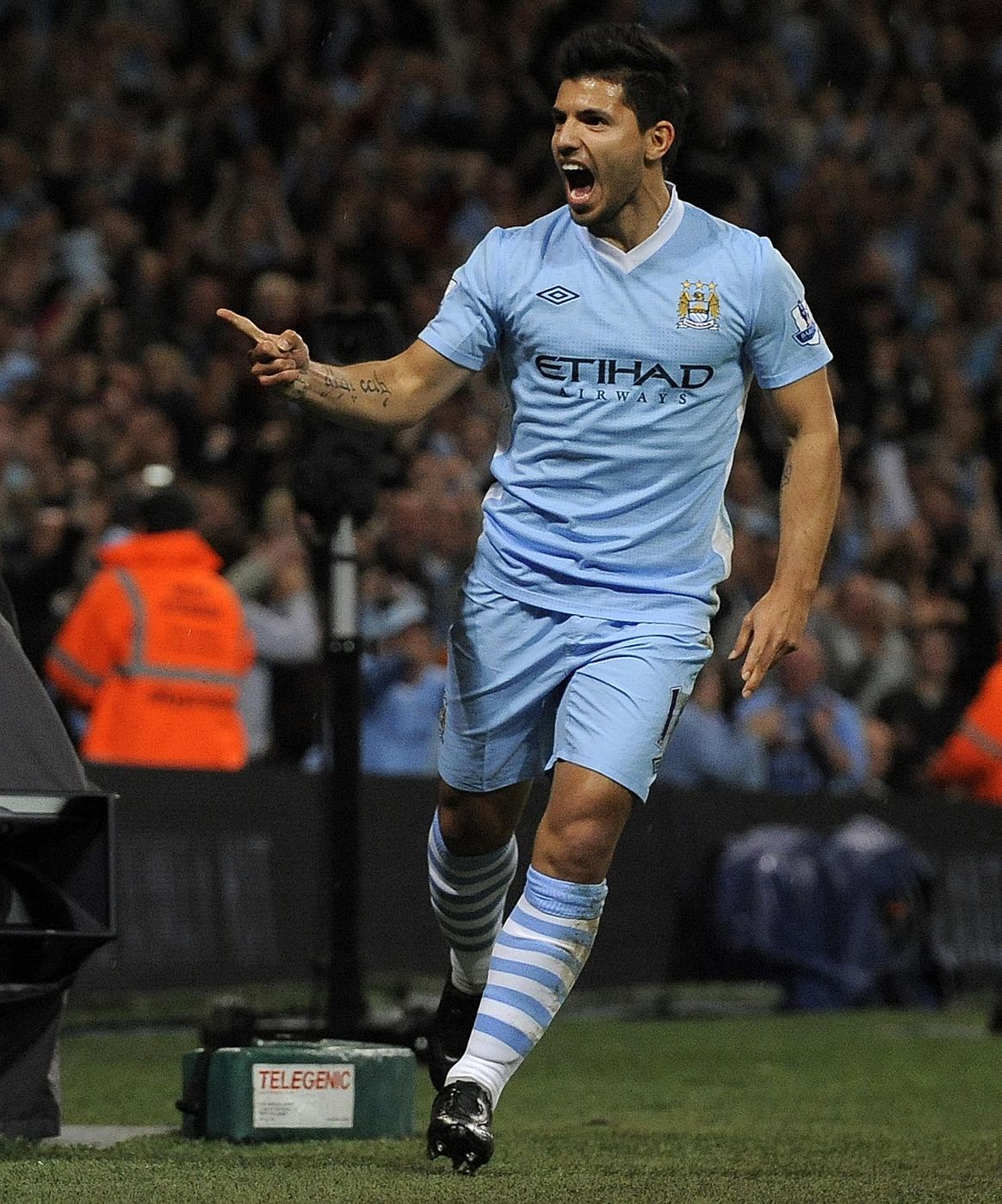 Manchester City's Aguero celebrates after scoring during their English Premier League soccer match against Swansea City in Manchester