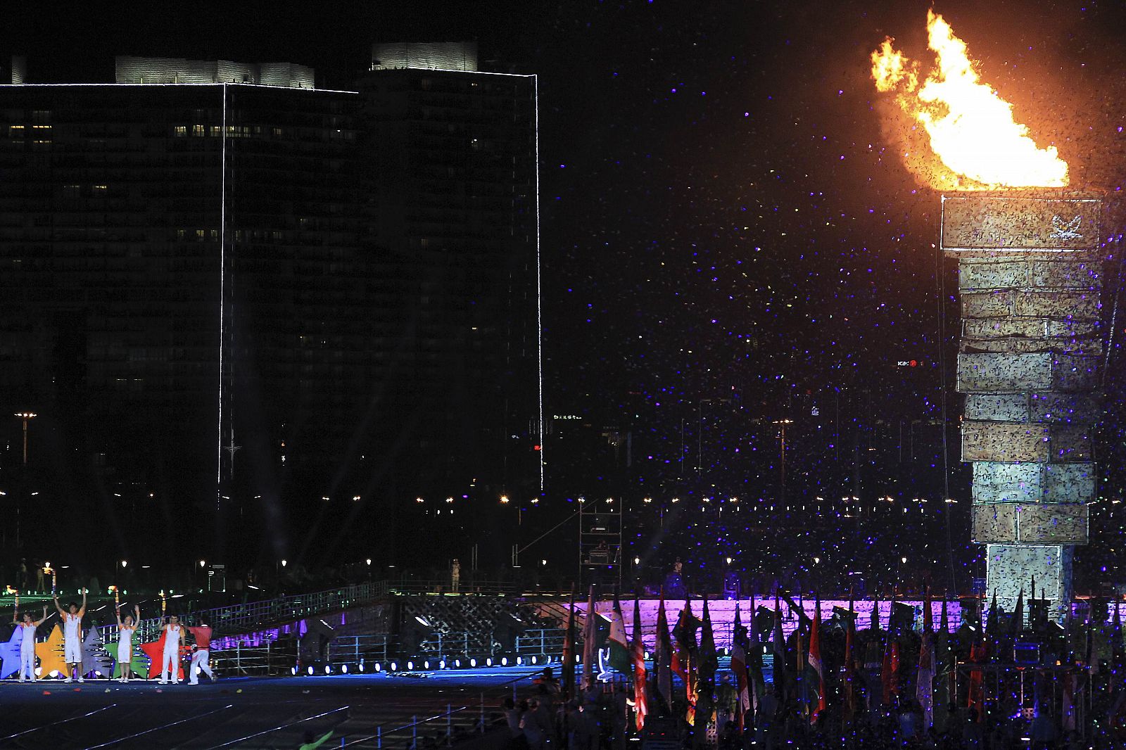 The flame is lit during the opening ceremony of the 26th Universiade games at Shenzhen Bay Sports Center in Shenzhen