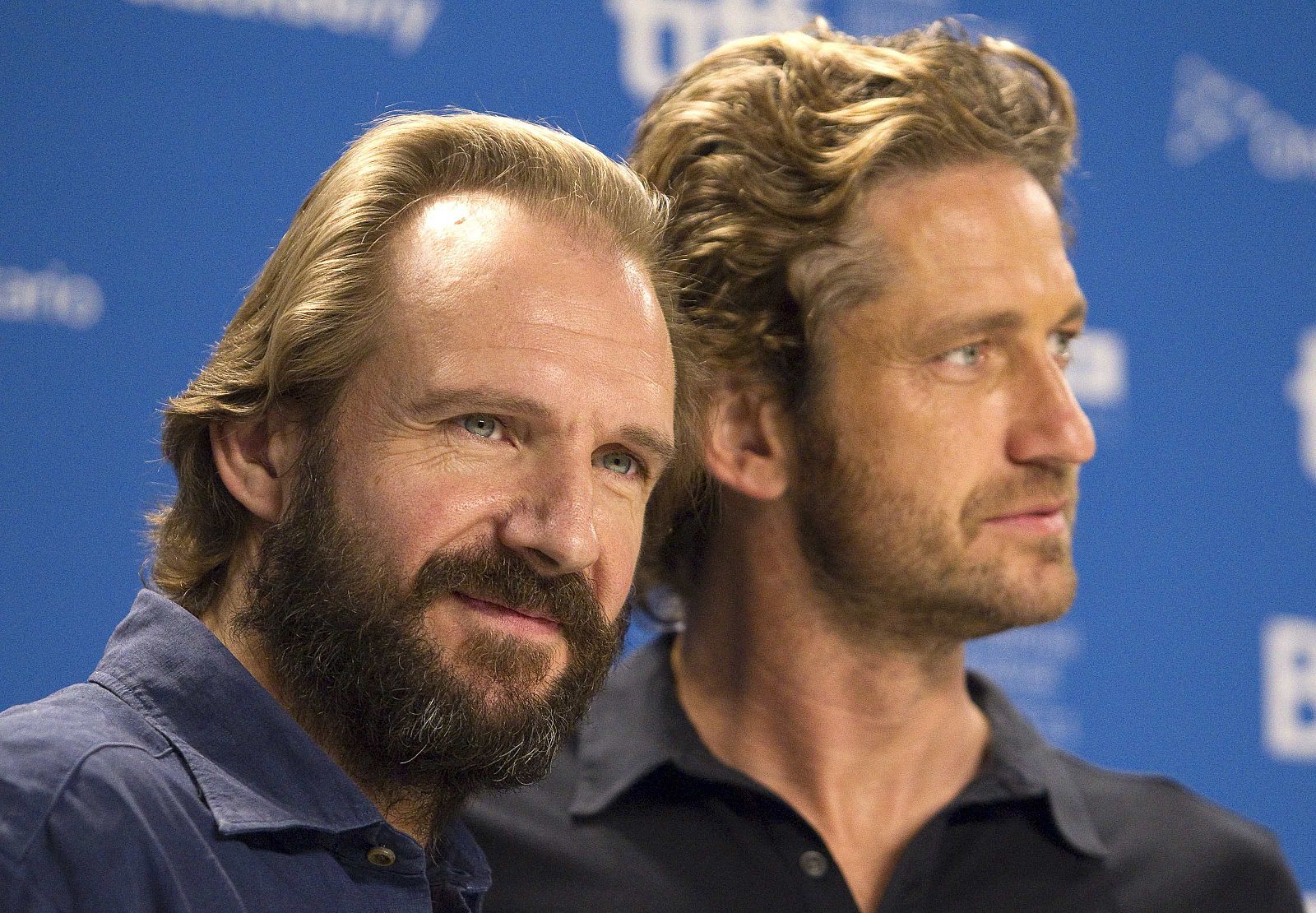 Director and actor Ralph Fiennes and actor Gerard Butler attend the news conference for the film "Coriolanus" at the 36th Toronto International Film Festival in Toronto