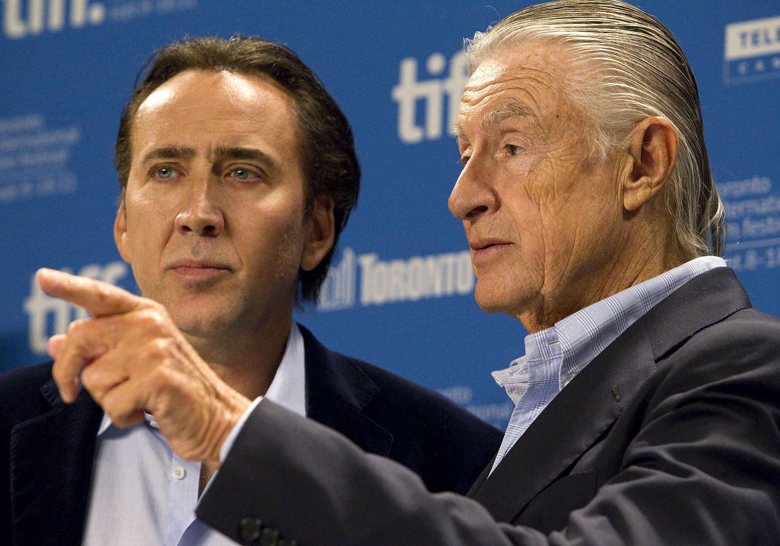 Director Joel Schumacher and cast member Nicolas Cage attend the news conference for the film "Trespass" at the 36th Toronto International Film Festival