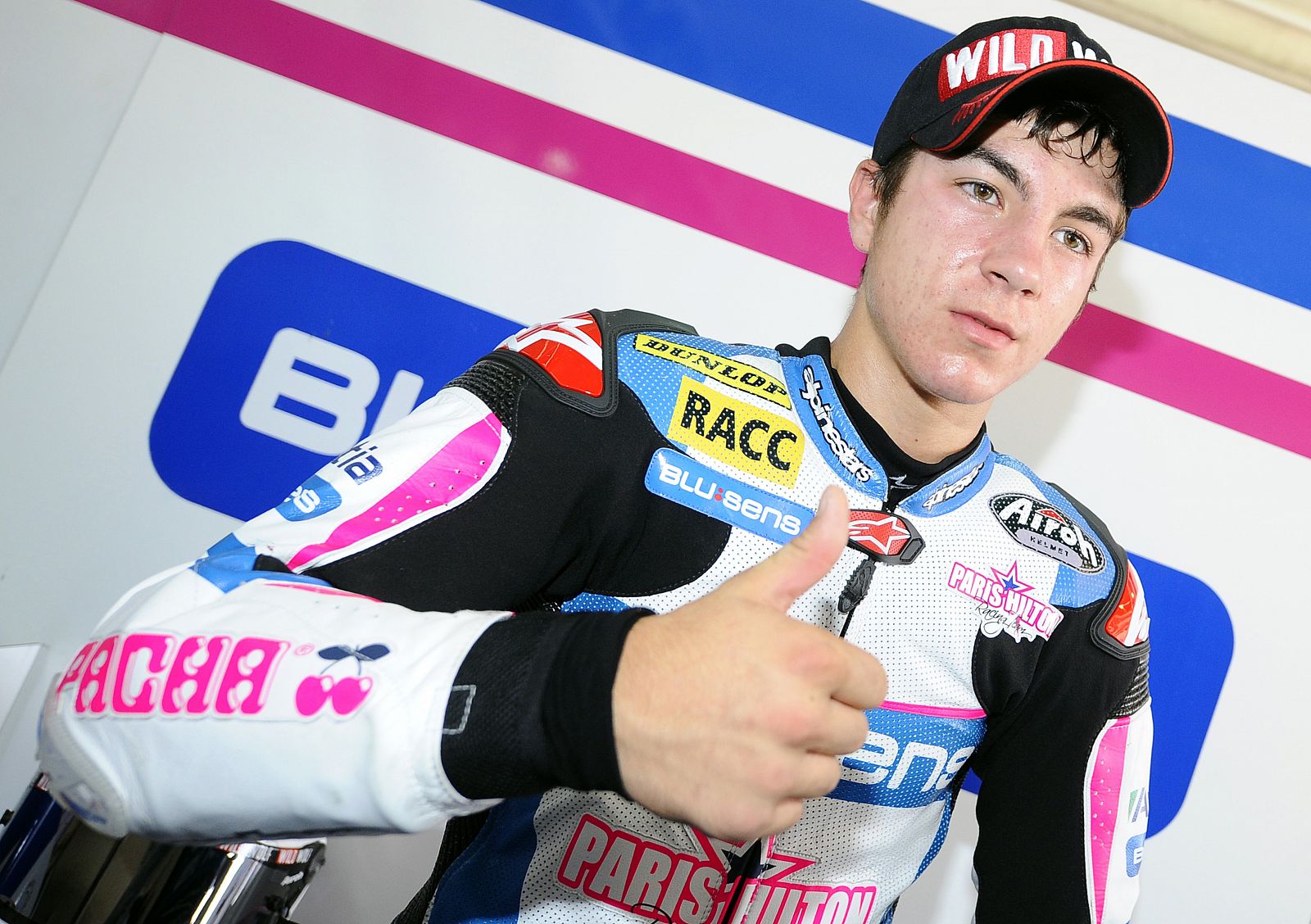 Aprilia 125cc rider Maverick Vinales of Spain flashes a thumbs-up after taking second position in the qualifying session of the Aragon Grand Prix in Alcaniz